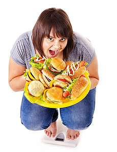 女人在体重秤上减肥孤立图片