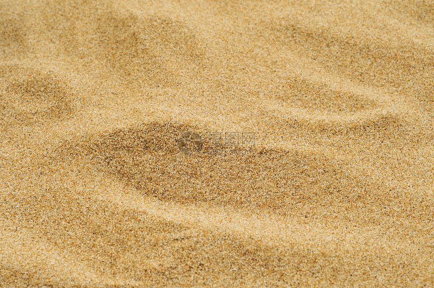 海滩或沙漠或沙坑的一堆沙子的特写图片