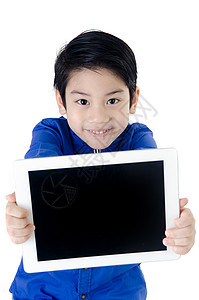 小亚洲男孩微笑与平板电脑图片