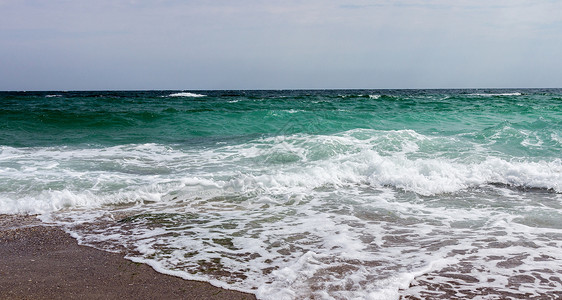 海滩沙子风景和波浪图片