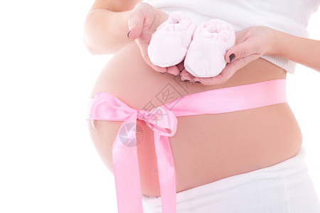 近距离的孕妇肚子中带有粉色丝带和婴儿图片