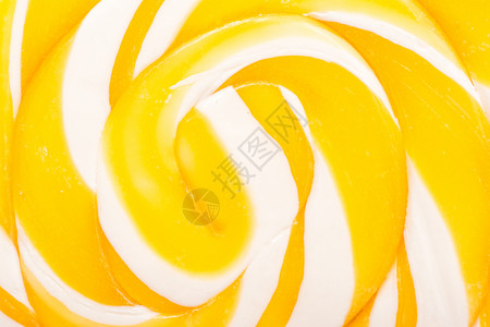 甜黄色螺旋棒糖特写图片