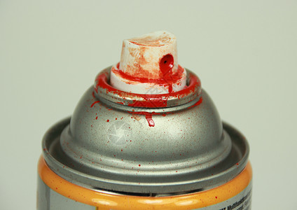 用红色油漆喷罐的顶部背景图片