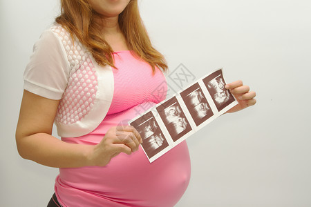 孕妇对腹部胚胎婴儿的超图片