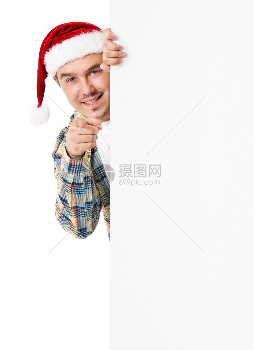戴着圣诞老人帽的年轻人在白板后面图片