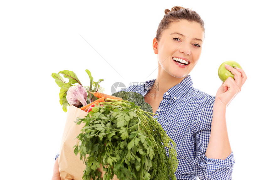 一张有蔬菜和苹果的快乐女人的照片照片图片