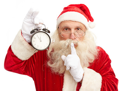 圣诞老人带着闹钟显示离午夜5分钟到午夜做手图片