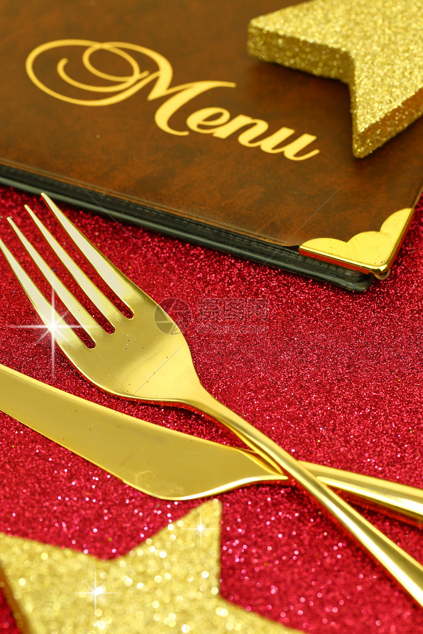 圣诞金餐具和餐厅菜单图片