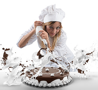 糕点厨师准备一个蛋糕配图片