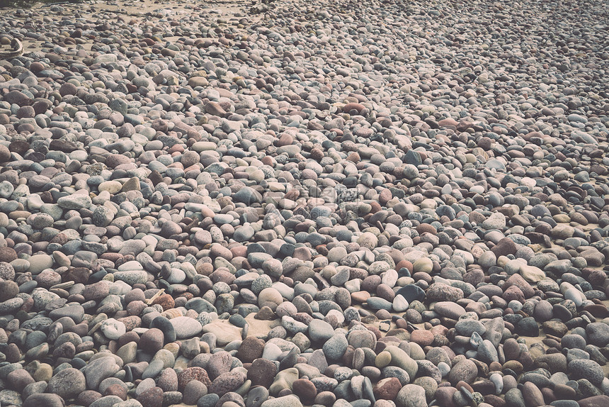 沙滩上的小卵石背景纹理古图片
