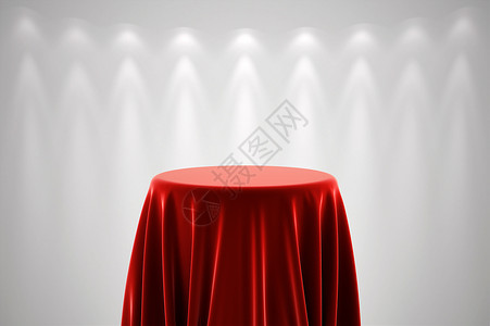 在白墙前用红色丝绸布覆盖圆形展示会的展台背景图片
