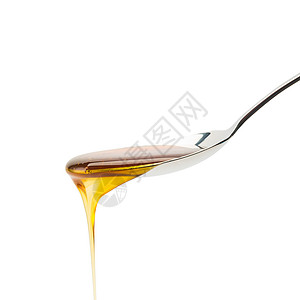 银汤匙和金蜂蜜在白色背景下流用5D3马克三号图片