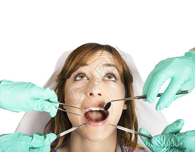 牙科诊所的女孩进行牙齿控制图片