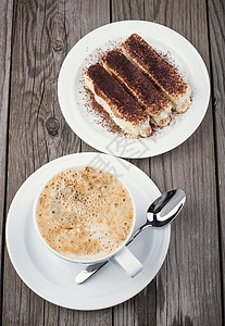 木制背景中的咖啡和饼干蛋糕图片