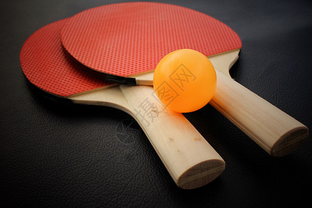 乒乓球拍：红黑色的木头桌上运动游戏图片