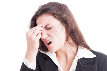 商业妇女患有痛苦的偏头痛和按额前白图片
