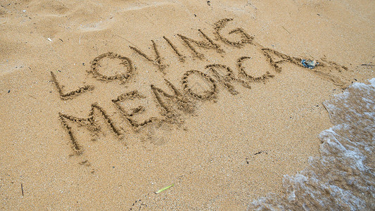 Menorca岛海滩度假在沙图片