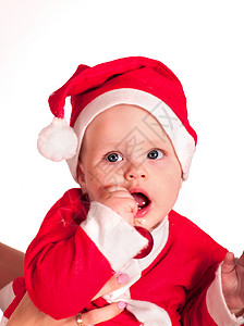 带着圣诞舞会的圣诞老人帽子穿小男孩婴儿服图片
