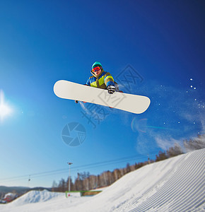 滑雪板滑雪者在空中跳跃图片