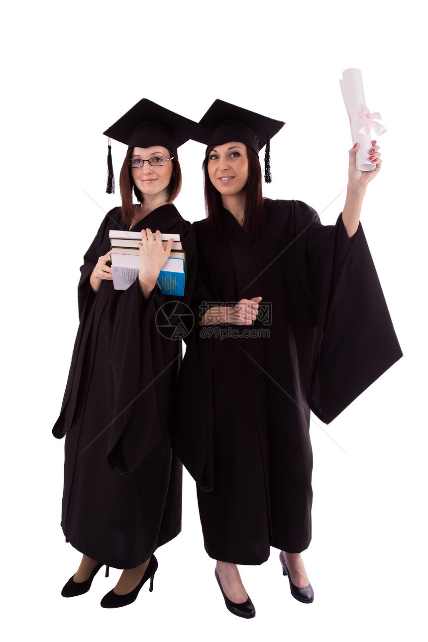 两个身穿学生衣的年轻女孩手握着文凭和书本图片