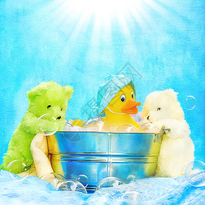 黄色橡皮鸭的有趣背景图像与两个泰迪熊朋友在桶中沐浴图片
