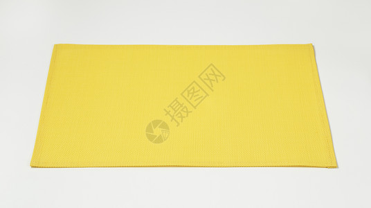 编织长方形黄色餐垫背景图片