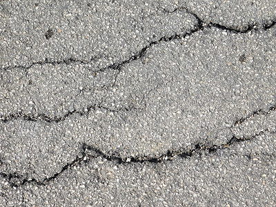 白天在户外塌陷的道路背景图片