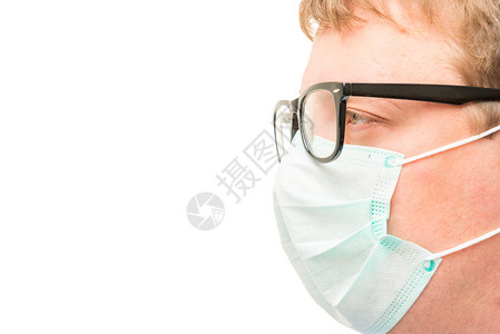 外科医生脸上戴眼镜和面具的面孔隔绝图片