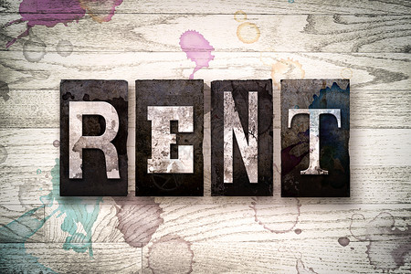 Rent这个词是用古老的脏金属印刷品写在有墨水和油漆污渍的白背景图片