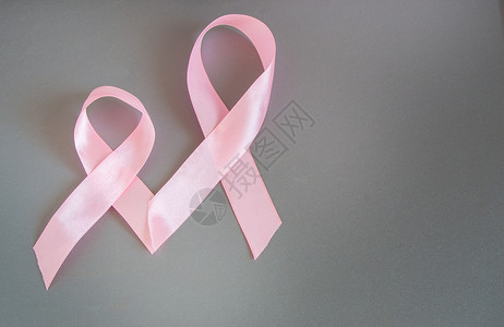 两条粉色丝带来提高对乳腺癌的认识图片