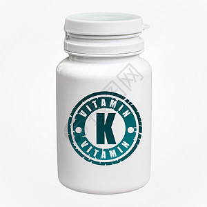一瓶白色背景中含有维生素K的药丸图片