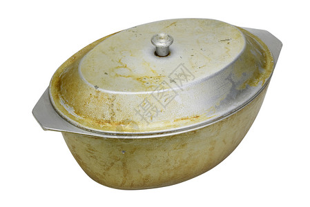 烤鸭或烧鸭的肥和铝制老脏煎锅被隔图片