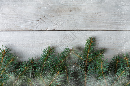 圣诞节背景与圣诞树和木帆布背景上闪发光的散景灯快乐圣诞贺卡寒假主题新年快乐文本的空图片