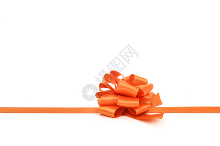 白色背景的橙色派边礼带弓图片