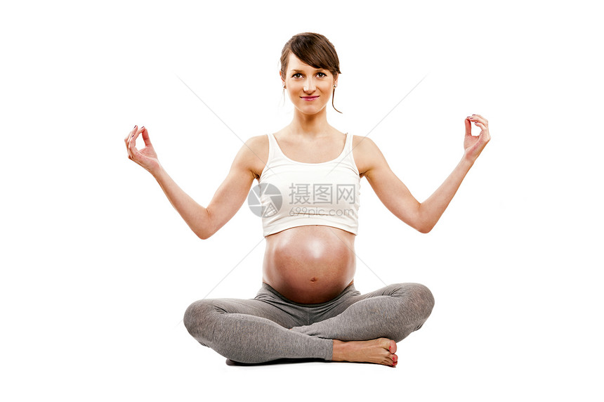 孕妇在休产假时进行冥想紧闭孕妇坐在莲眼图片