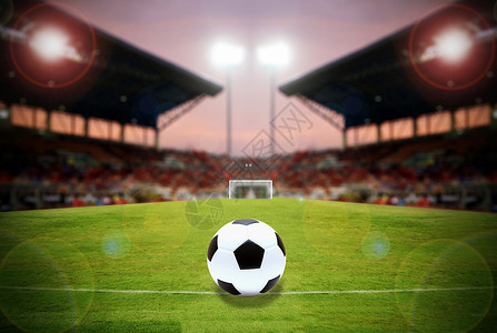 足球场绿色球场上的足球和体育场足球场冠军赢得背景图片