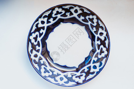 乌兹别克全国瓷桌餐具PaxtaCotton边有经典装饰品板化贝克棉花的牌背景图片