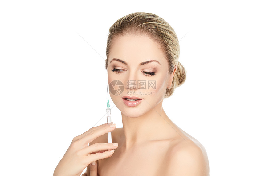 美女拿着注射针筒用科拉根做治疗注射图片