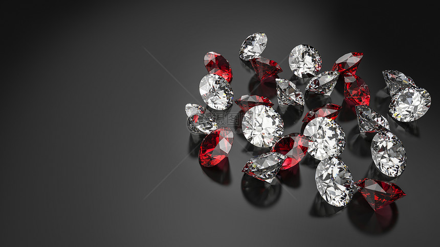 黑色背景上的钻石和红宝石图片