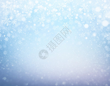 冷冻蓝底的雪花和下雪图片