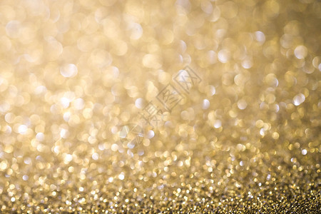 金色摘要圣诞节闪烁的明亮背景图片