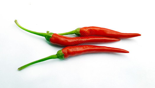 白色背景上的新鲜红辣椒图片