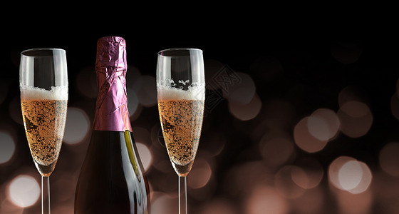瓶和两杯香槟新年庆典图片