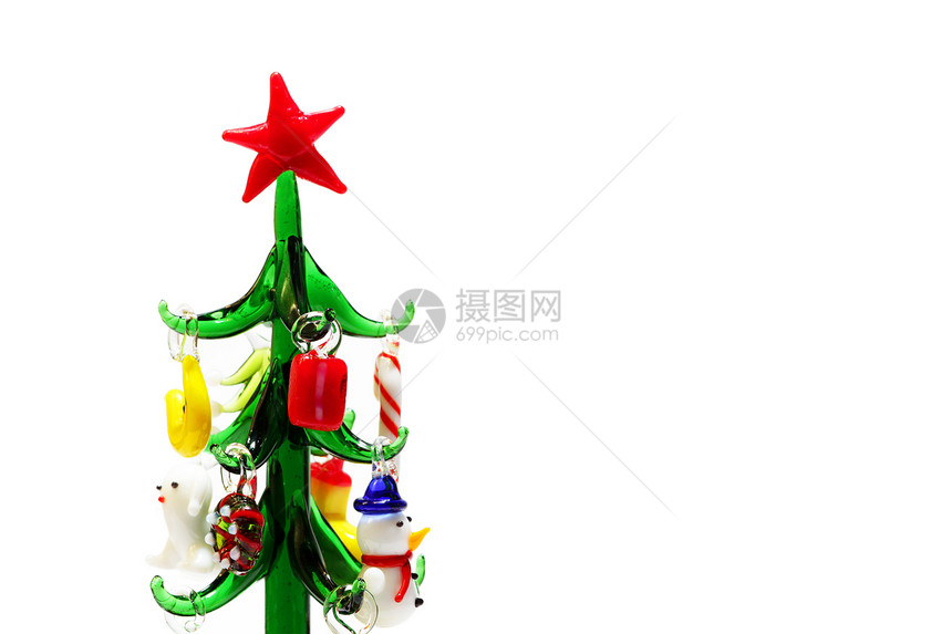 圣诞玻璃小人字形与微型彩色玩具白色背景上的新年纪念品图片