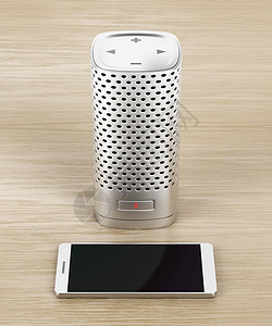 木质背景上的银色智能扬声器和智能手机图片