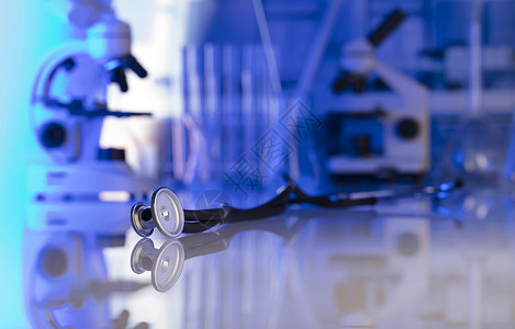 医疗保健医疗概念听诊器显微镜实验室背景实验室玻璃器皿蓝色背景图片