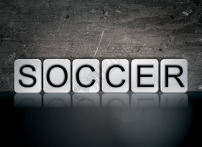 足球概念和主题这个字用白色瓷砖写背景图片