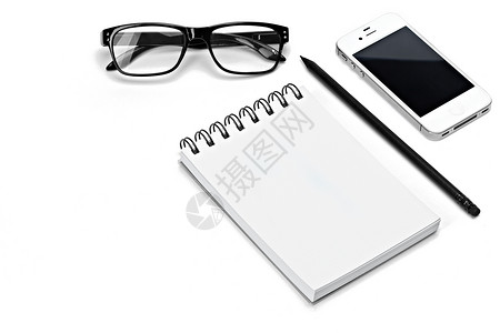 白笔记本眼镜笔白背景上孤立图片