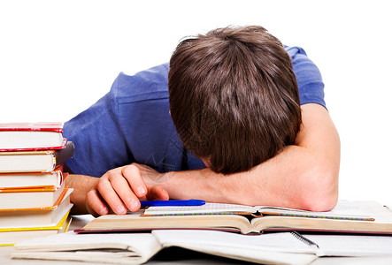 无聊的学生睡在白色背景的图片