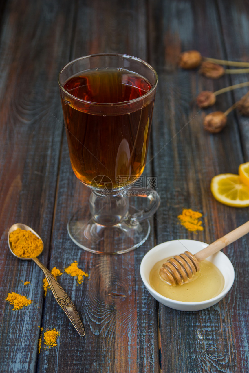 茶调味品蜂蜜和柠檬在木图片